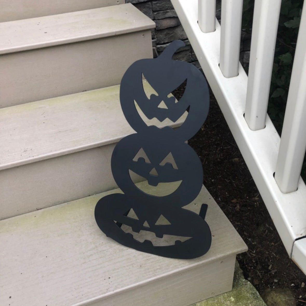 3 Stacked Carved Pumpkins